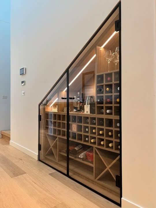 frameless glass under stair cellar for storage of wine botte